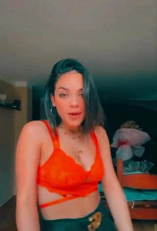 5. Sexy Giulia Paglianiti Shows Cleavage in Electric Orange Bra