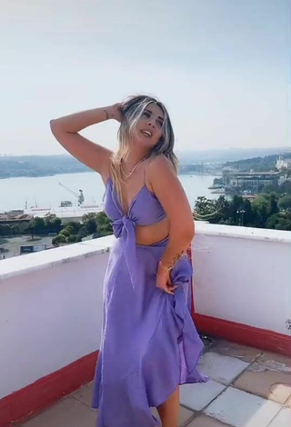 4. Sweetie Gizemjelii in Purple Crop Top on the Balcony