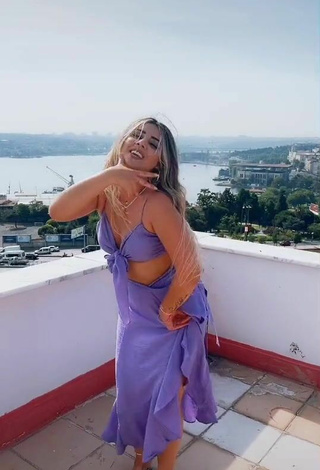 5. Sweetie Gizemjelii in Purple Crop Top on the Balcony