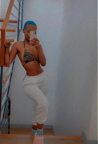 6. Sexy Vivian Gold Kaitetsi Shows Cleavage in Camouflage Bikini Top