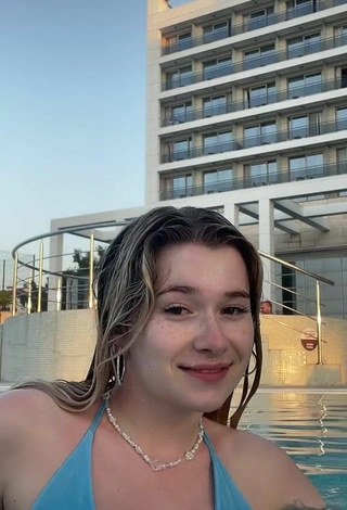 Sexy Rina Shows Cleavage in Blue Bikini Top at the Swimming Pool