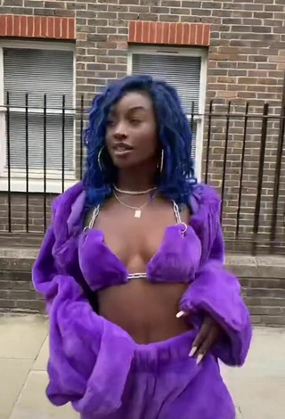 2. Sexy Oluwanifewa Agunbiade Shows Cleavage in Violet Bikini Top in a Street