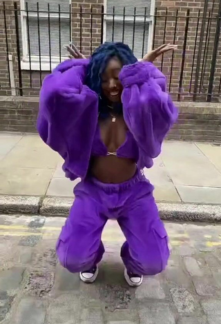 5. Sexy Oluwanifewa Agunbiade Shows Cleavage in Violet Bikini Top in a Street