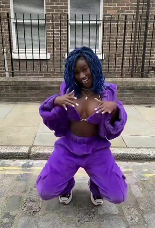 6. Sexy Oluwanifewa Agunbiade Shows Cleavage in Violet Bikini Top in a Street