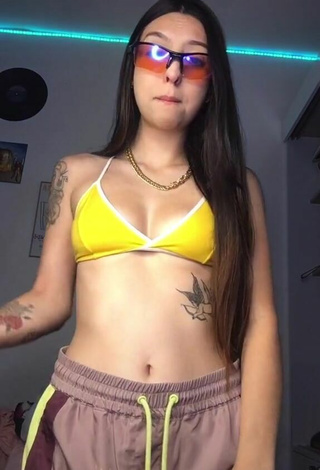2. Julia Guerra Shows Cleavage in Inviting Yellow Bikini Top