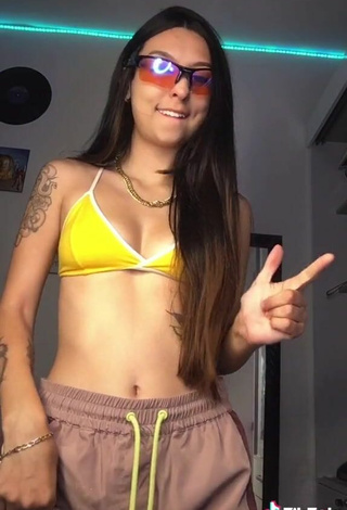 5. Julia Guerra Shows Cleavage in Inviting Yellow Bikini Top