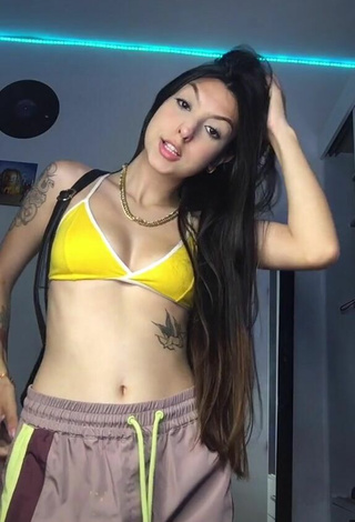 2. Julia Guerra Shows Cleavage in Seductive Yellow Bikini Top