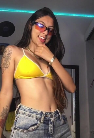 2. Adorable Julia Guerra Shows Cleavage in Seductive Yellow Sport Bra
