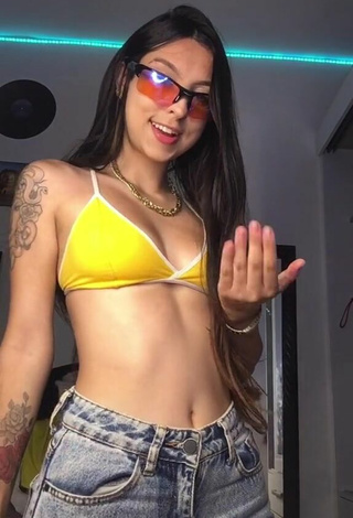 3. Adorable Julia Guerra Shows Cleavage in Seductive Yellow Sport Bra
