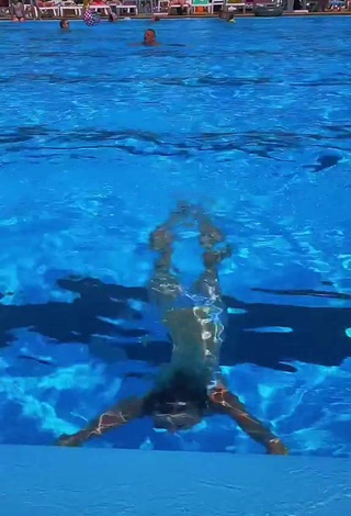 Sexy Lera Kantur Shows Cleavage in Blue Bikini Top at the Swimming Pool