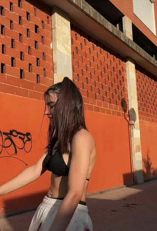 4. Wonderful Kiara Brunett in Black Bikini Top in a Street