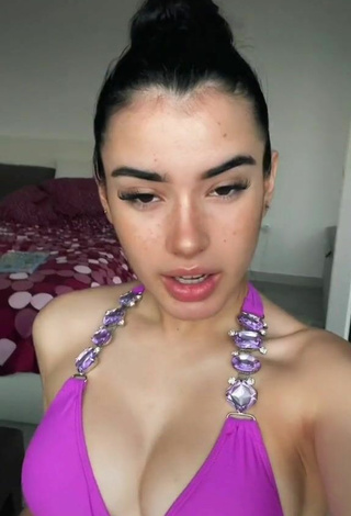 Sexy Kiara Brunett Shows Cleavage in Violet Bikini Top