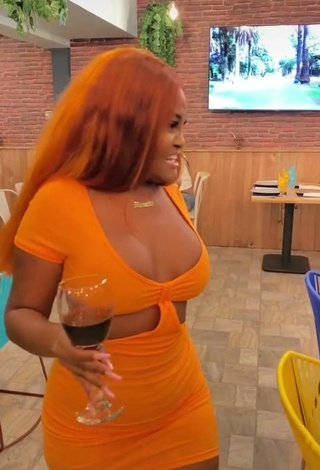 Hot Lajesuu Shows Cleavage in Orange Dress