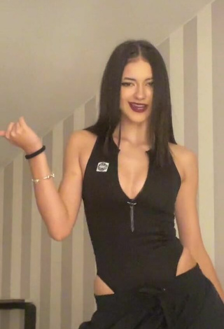 3. Sexy Liza Nice Shows Cleavage in Black Bodysuit