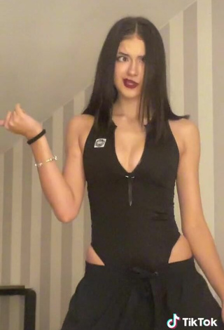 5. Sexy Liza Nice Shows Cleavage in Black Bodysuit