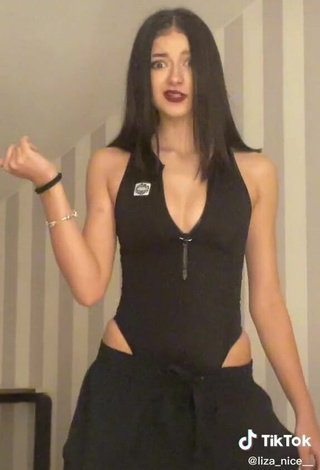 6. Sexy Liza Nice Shows Cleavage in Black Bodysuit