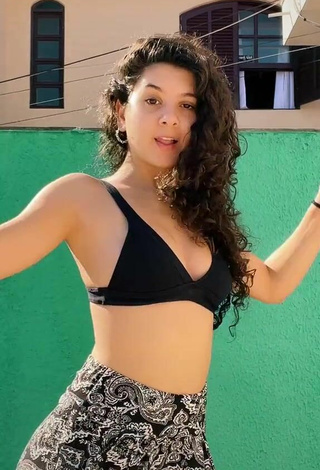 2. Sexy Lorena Tucci Shows Cleavage in Black Bikini Top