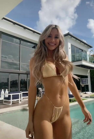6. Sexy Mariana Morais Shows Cleavage in Golden Bikini at the Pool