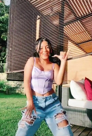 6. Beautiful Mafe Vásquez Shows Cleavage in Sexy Purple Crop Top