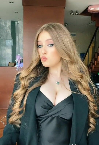 4. Sexy Viktoria Nikulina Shows Cleavage in Black Dress