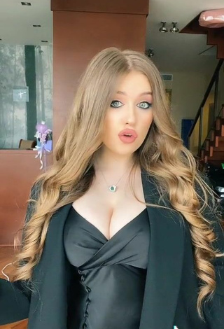 5. Sexy Viktoria Nikulina Shows Cleavage in Black Dress