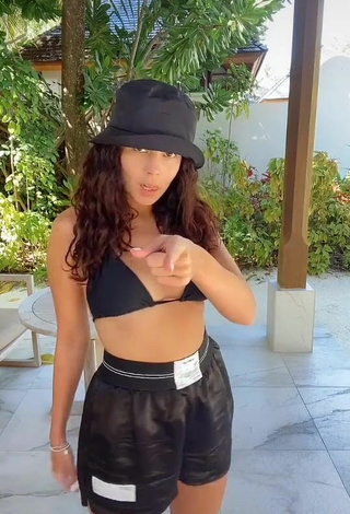 Hot Nastia Kamenskykh Shows Cleavage in Black Bikini Top