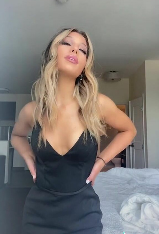 3. Sexy Megan Eugenio Shows Cleavage in Black Dress