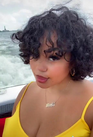 5. Hottie Phaith Montoya Shows Cleavage in Yellow Dress on a Boat