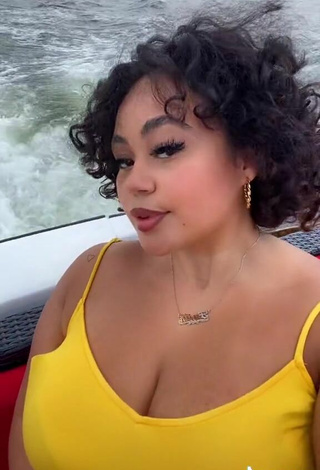 6. Hottie Phaith Montoya Shows Cleavage in Yellow Dress on a Boat