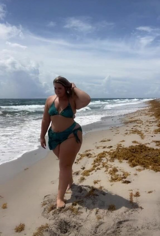 2. Erotic Sam Paige Shows Cleavage in Green Bikini at the Beach