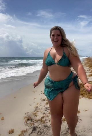 6. Erotic Sam Paige Shows Cleavage in Green Bikini at the Beach