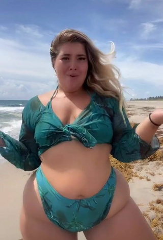 2. Hottie Sam Paige Shows Cleavage in Green Bikini at the Beach