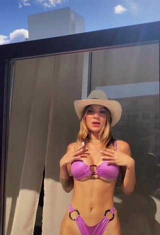 Adorable Sasha Ferro Shows Cleavage in Seductive Purple Bikini