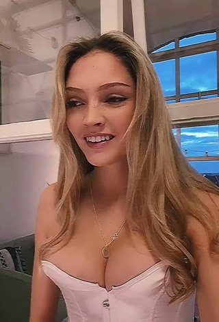 4. Sexy India Rawsthorn Shows Cleavage in White Corset