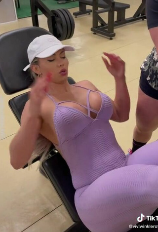 6. Seductive Vivi Winkler Shows Cleavage in Purple Overall in the Sports Club