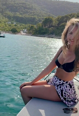 6. Sexy Julia Fröhlich Shows Cleavage in Black Bikini Top in the Sea on a Boat