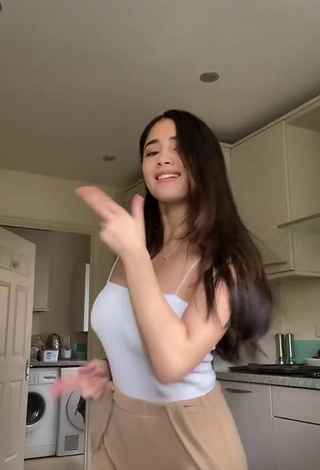 2. Sexy Aaliyah De Gracia Shows Cleavage in White Top Braless