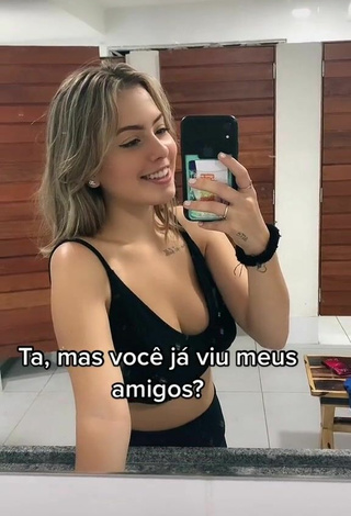 Sexy Alice Neves Shows Cleavage in Black Sport Bra