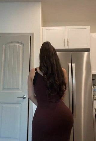 5. Hot Alondra Ortiz Shows Cleavage in Brown Dress