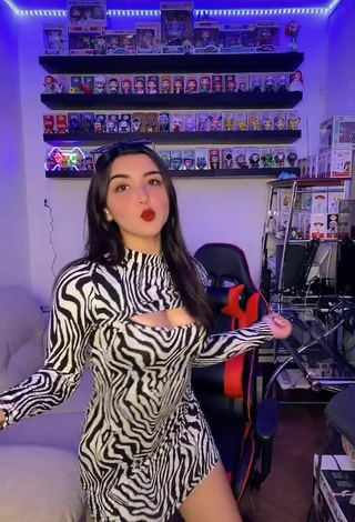 6. Hot Andyy Tok Shows Cleavage in Zebra Dress