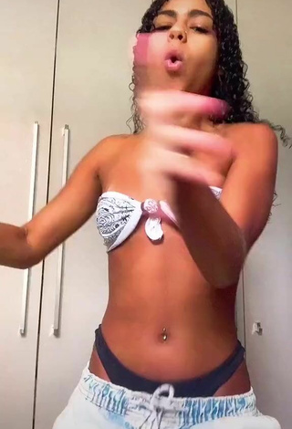 6. Seductive Angel Oficial Shows Cleavage in Bikini Top