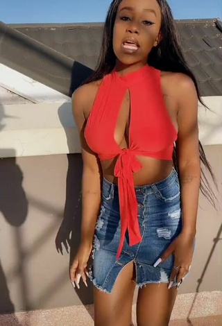2. Sexy Azziad Nasenya Shows Cleavage in Orange Crop Top No  Bra