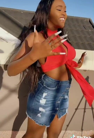 5. Sexy Azziad Nasenya Shows Cleavage in Orange Crop Top No  Bra