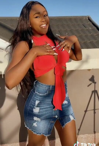6. Sexy Azziad Nasenya Shows Cleavage in Orange Crop Top No  Bra