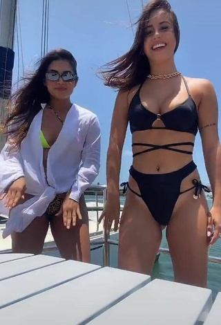 3. Seductive Bianca Jesuino Shows Cleavage in Black Bikini on a Boat