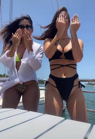 6. Seductive Bianca Jesuino Shows Cleavage in Black Bikini on a Boat