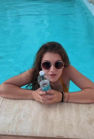 6. Sexy Giada Bosetti Shows Cleavage in Orange Bikini Top at the Pool