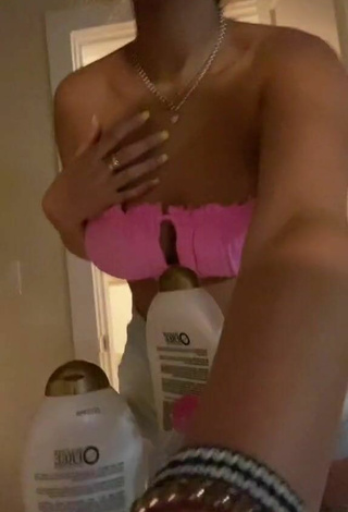 3. Sexy Corinne Carr Shows Cleavage in Pink Bikini Top