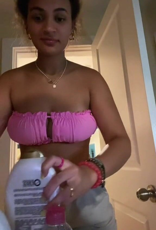 4. Sexy Corinne Carr Shows Cleavage in Pink Bikini Top