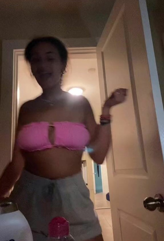 6. Sexy Corinne Carr Shows Cleavage in Pink Bikini Top
